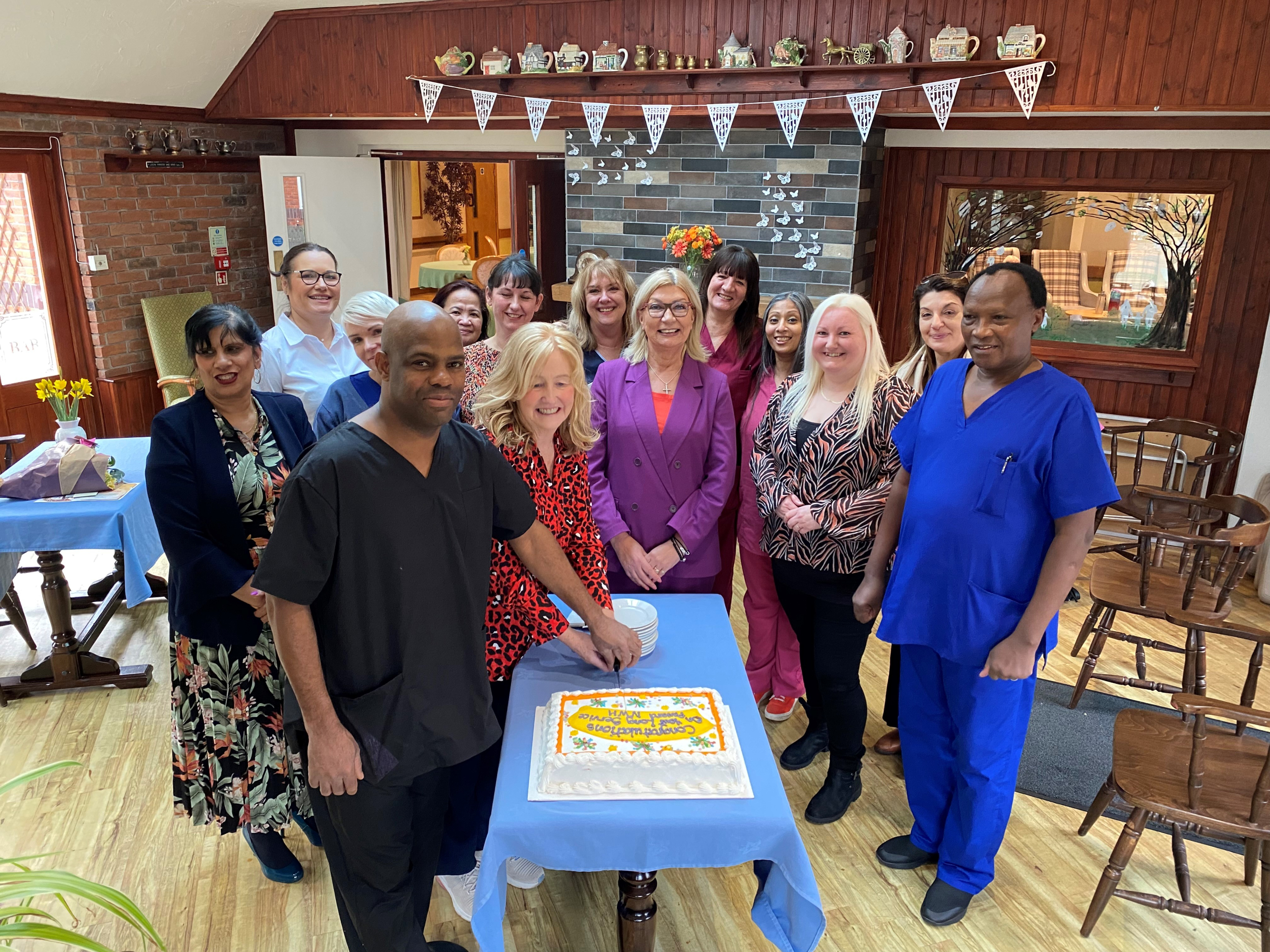 Staff and Trustees celebrate special long-serving members of staff at Neville Williams House