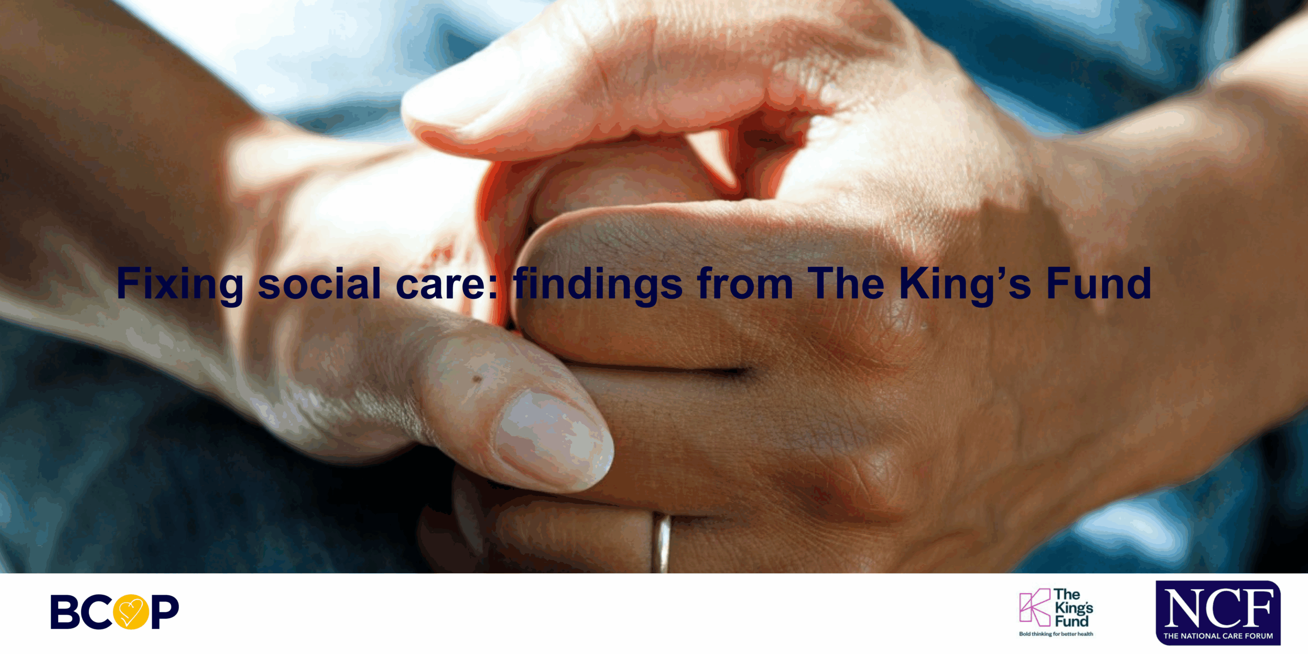 Older person and care worker holding hands