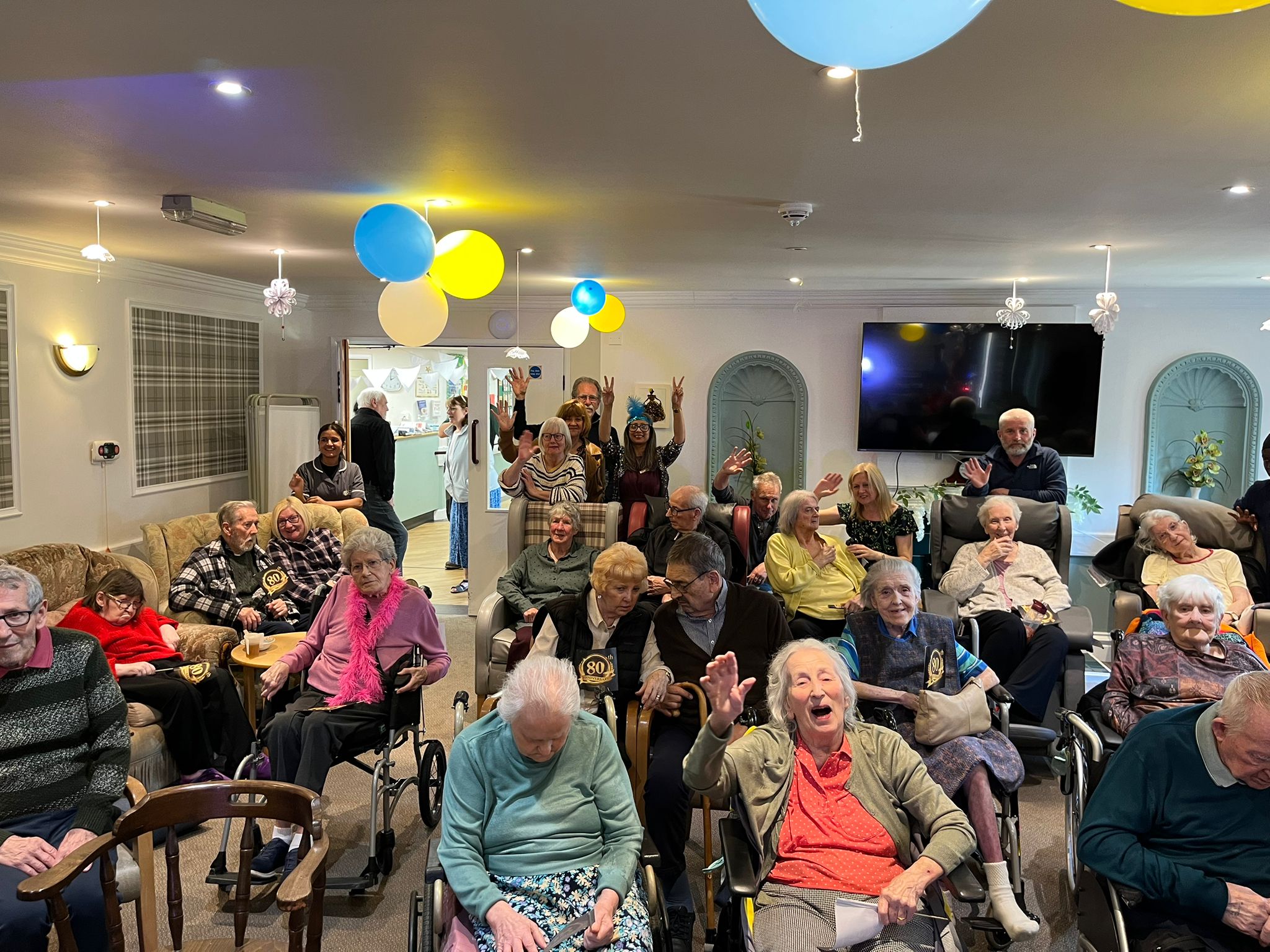 Residents, families and staff at Neville Williams House at their 80th anniversary celebration 'Step back in time'